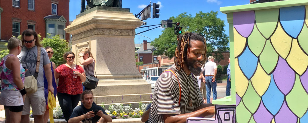 Public Piano Performance in the Square with a Statue, Photo Credit: Robert Witkowski