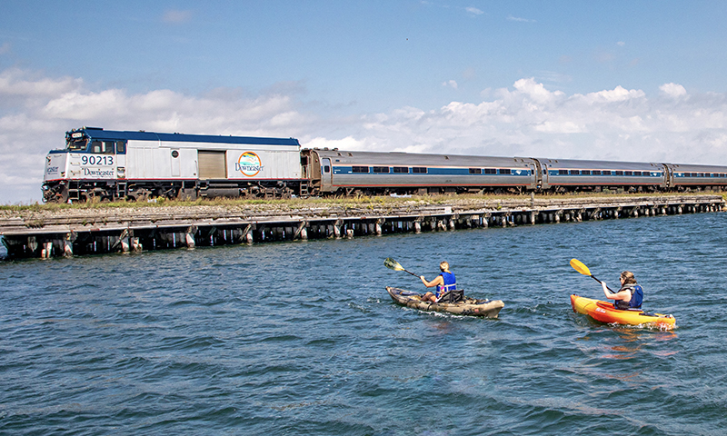 Amtrak Downeaster Passing Kayakers. Photo Courtesy of NNEPRA