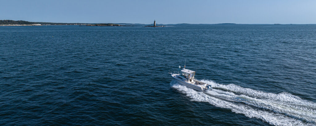 Fore River Sportfishing cruising on water, Photo Credit: PGM Photography