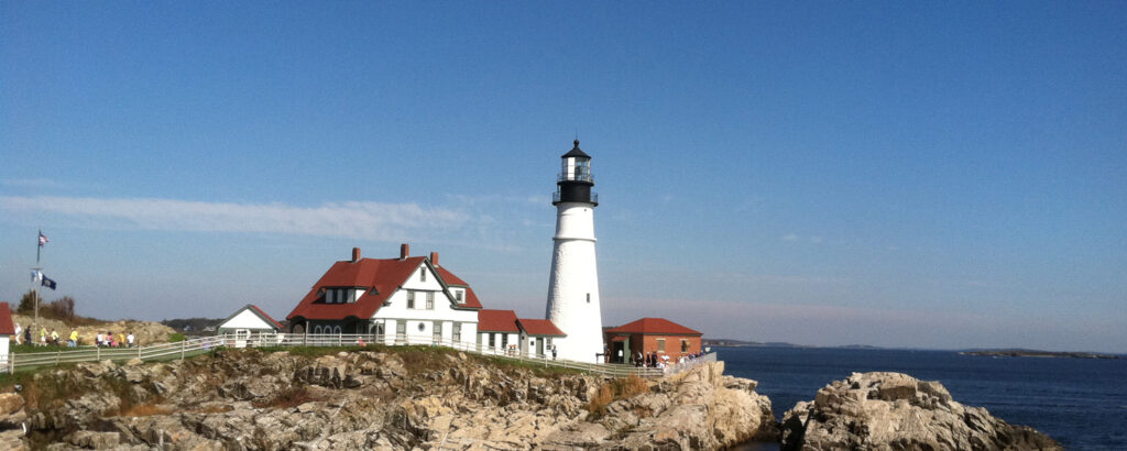 Portland Head Light on a sunny day; Photo Credit Summer Feet Cycling