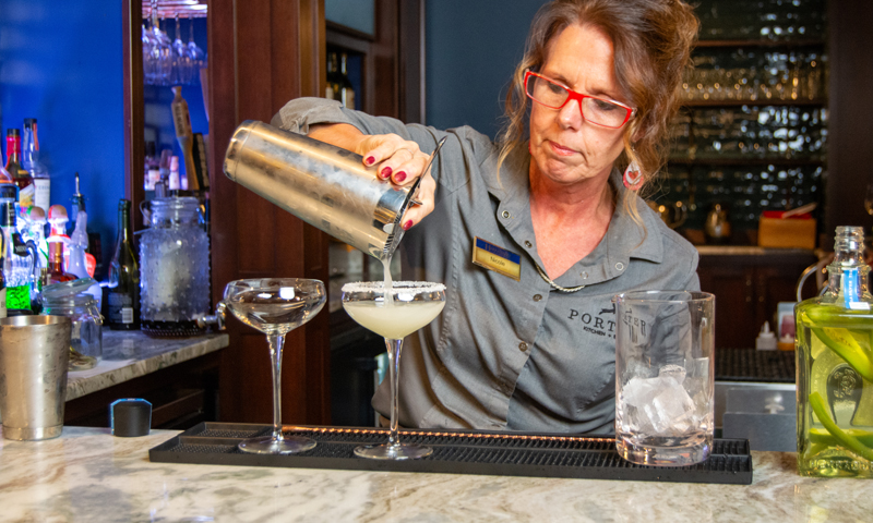 Bartender making drinks; Photo Credit: Lauren Peters at Visit Portland