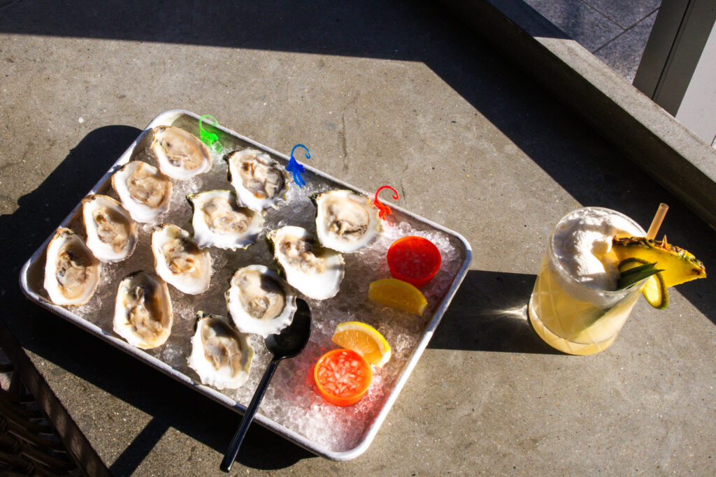 Oysters and Cocktail at Paper Tiger. Photo Credit: Northern Attitude Creative