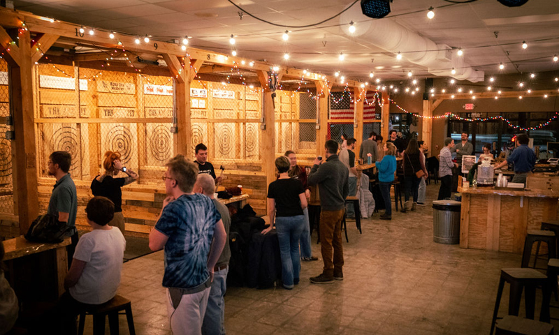 People throwing axes; Photo Credit: Nate Davis